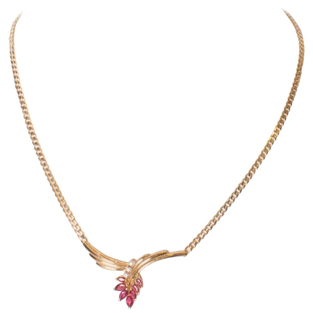 A Vintage Ruby, Diamond and Gold Pendant Necklace.