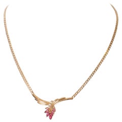 A Vintage Ruby, Diamond and Gold Pendant Necklace.
