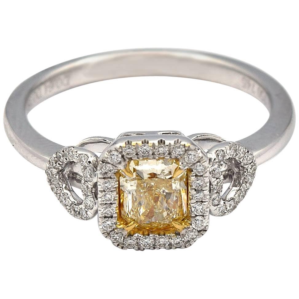 0.64 Carat Radiant Natural Yellow Diamond Ring in 18 Karat White Gold For Sale