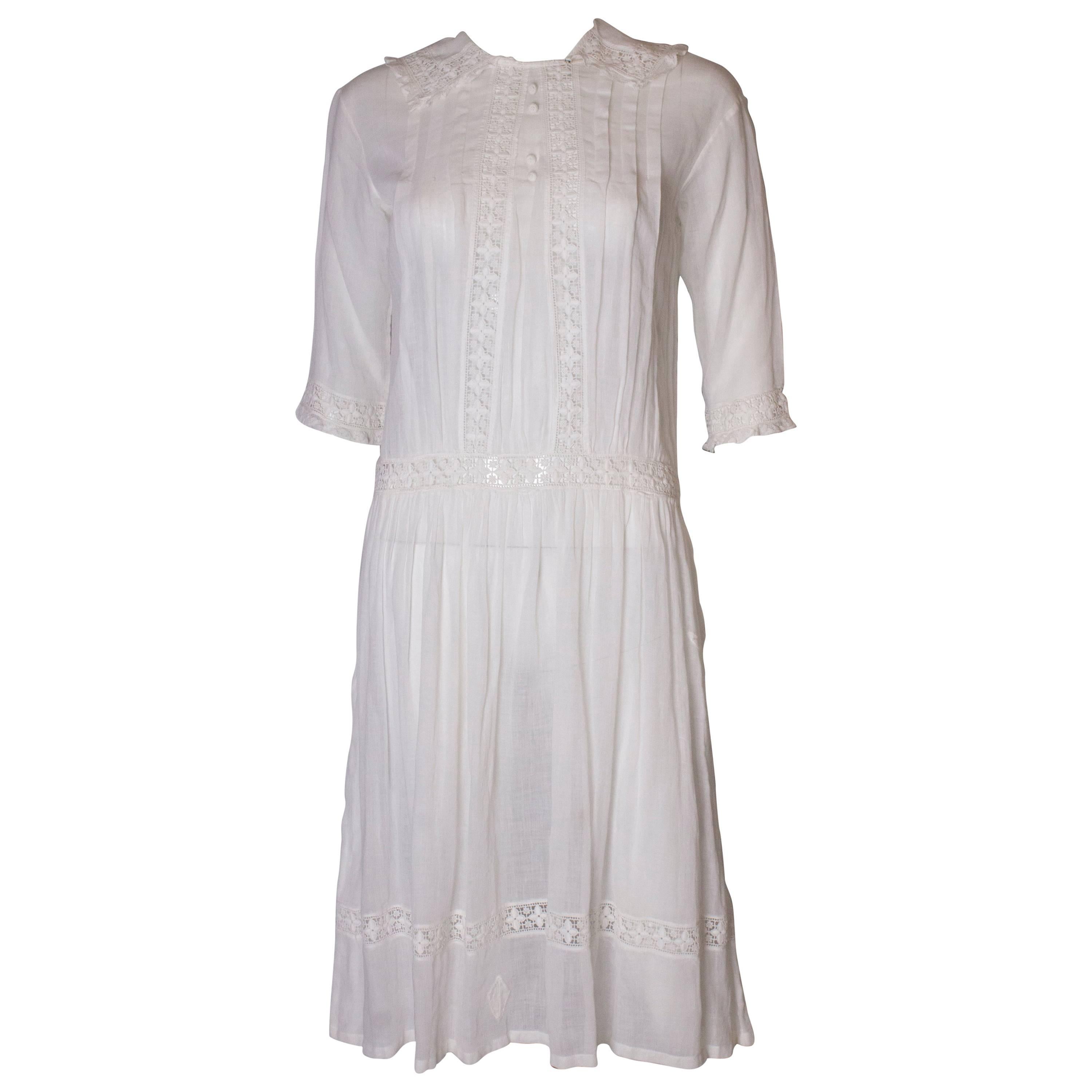 A Vintage edwardian lawn cotton dress with delicate embroidered flowers 