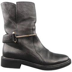BALENCIAGA Size 7 Black Textured Leather Gold Metal Strap Biker Boots