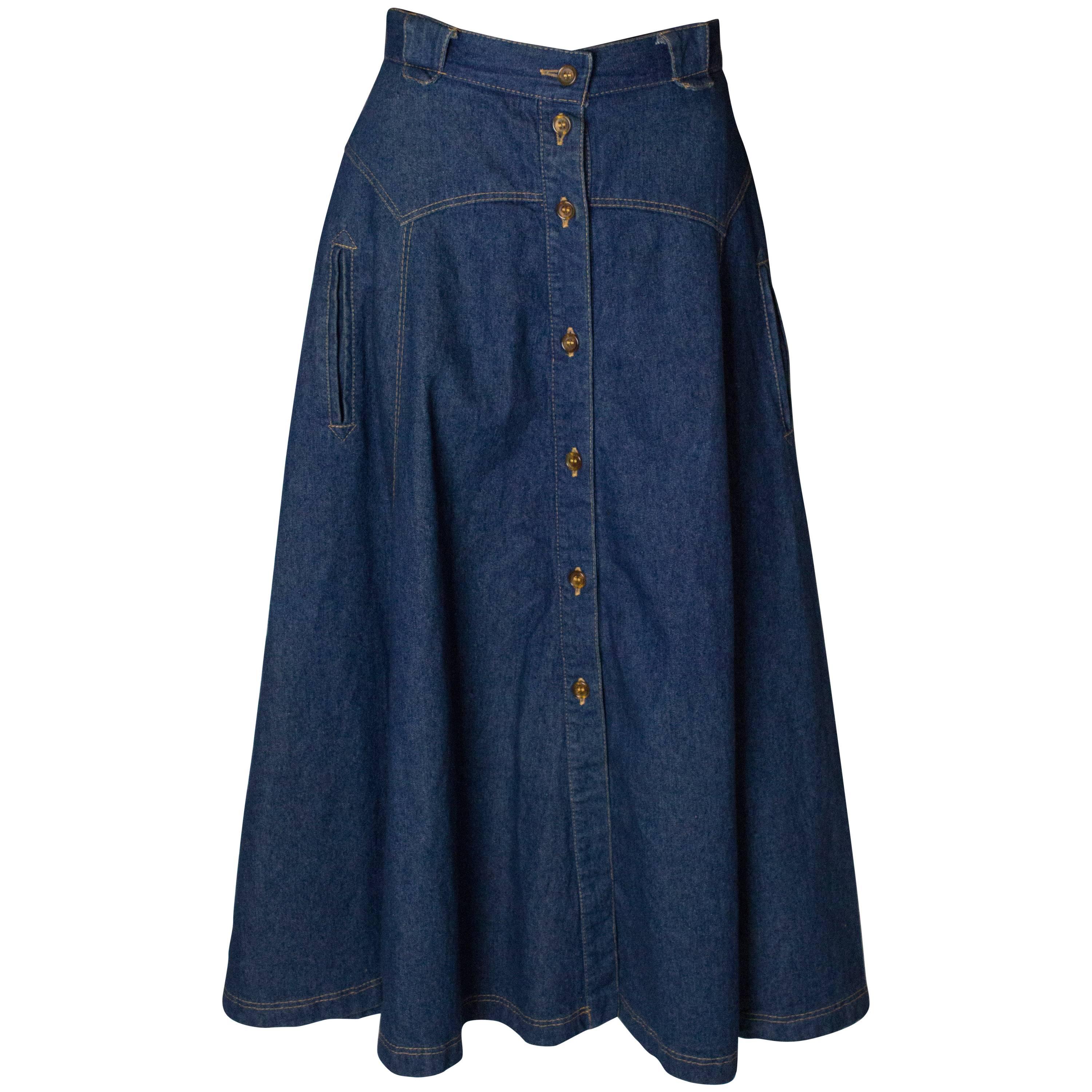 A Vintage 1970s button up a line high waisted mid length Denim Skirt 