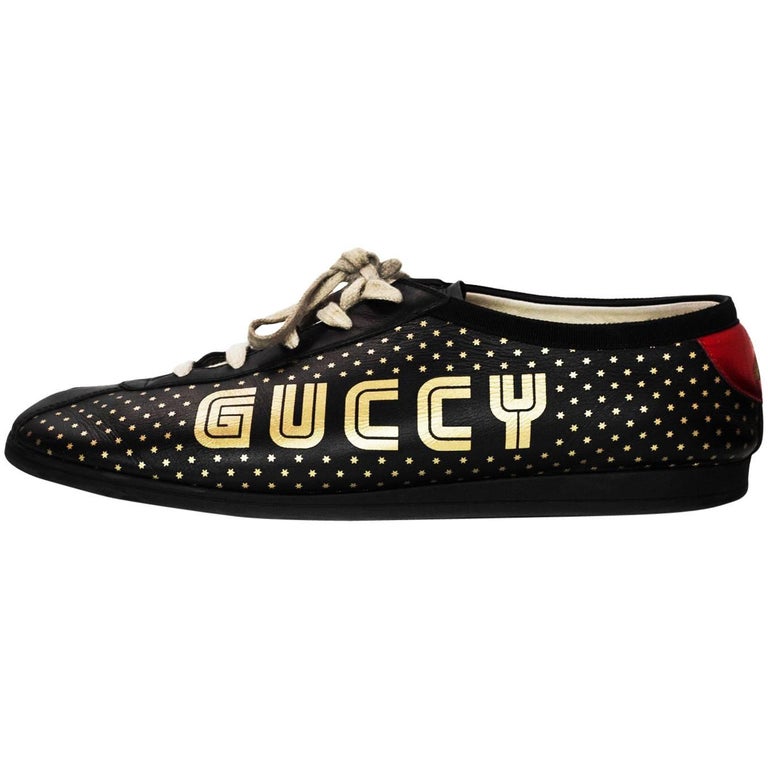 Gucci Men's Black and Gold Falacer Guccy Sega Logo Sneakers Sz  For Sale  at 1stDibs | gucci falacer mens, gucci sega logo, black and gold gucci  sneakers