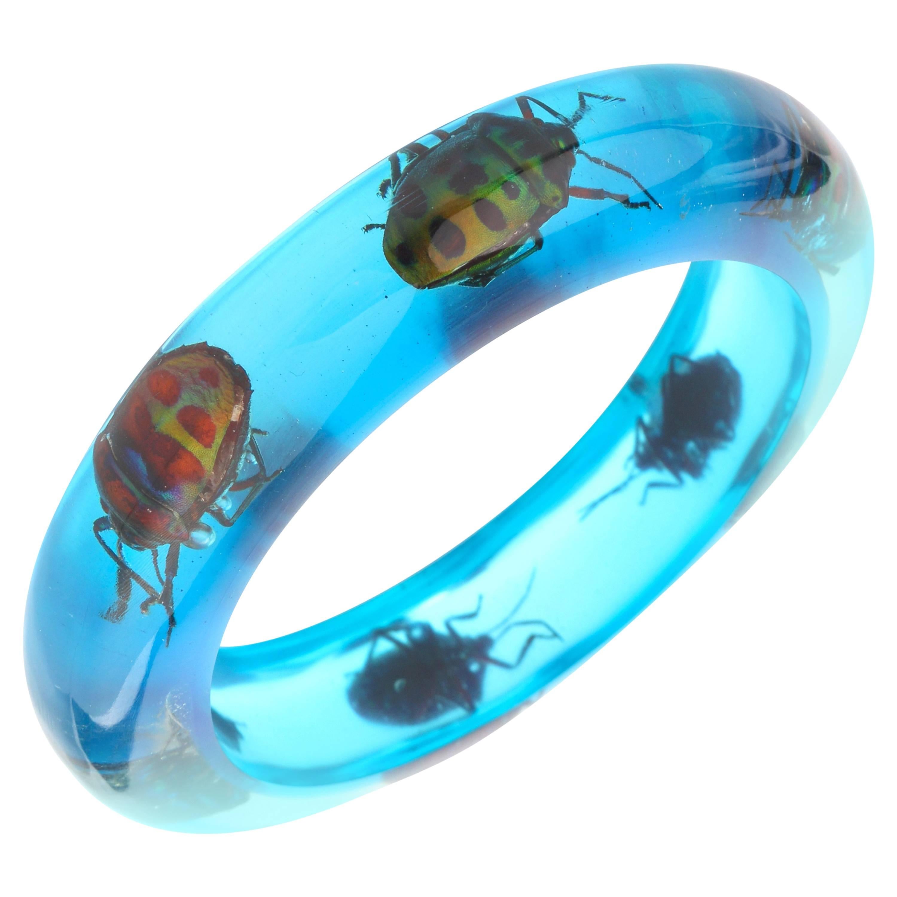 Vintage Blue Translucent Lucite Iridescent Beetle Embedded Bangle Bracelet