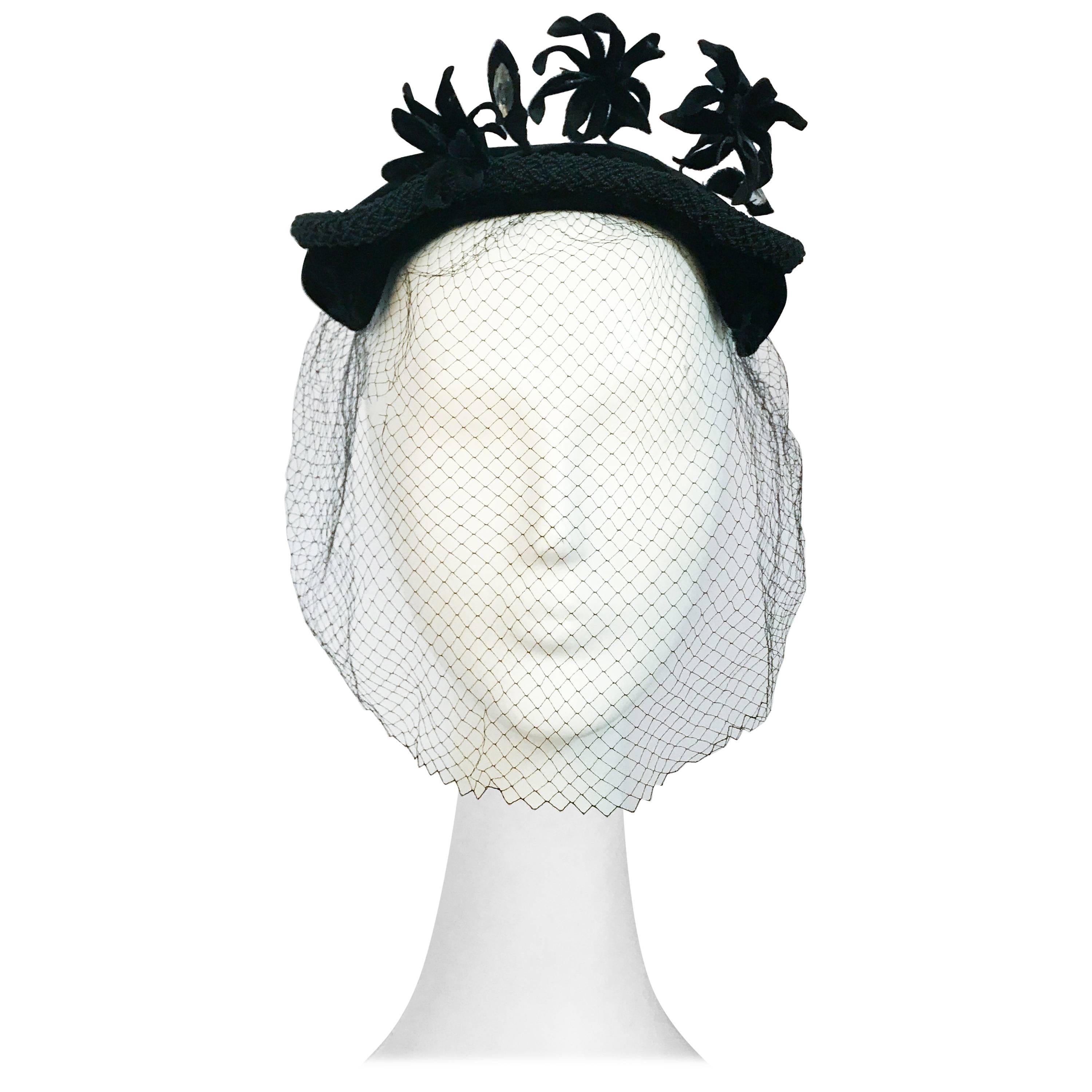 1950s Black Velvet Cocktail Hat with Veil and Flower Embellishments For Sale