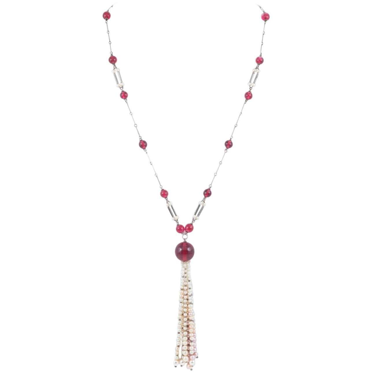 Art Deco cranberry glass and pearl sautoir, with unmarked silver links. 