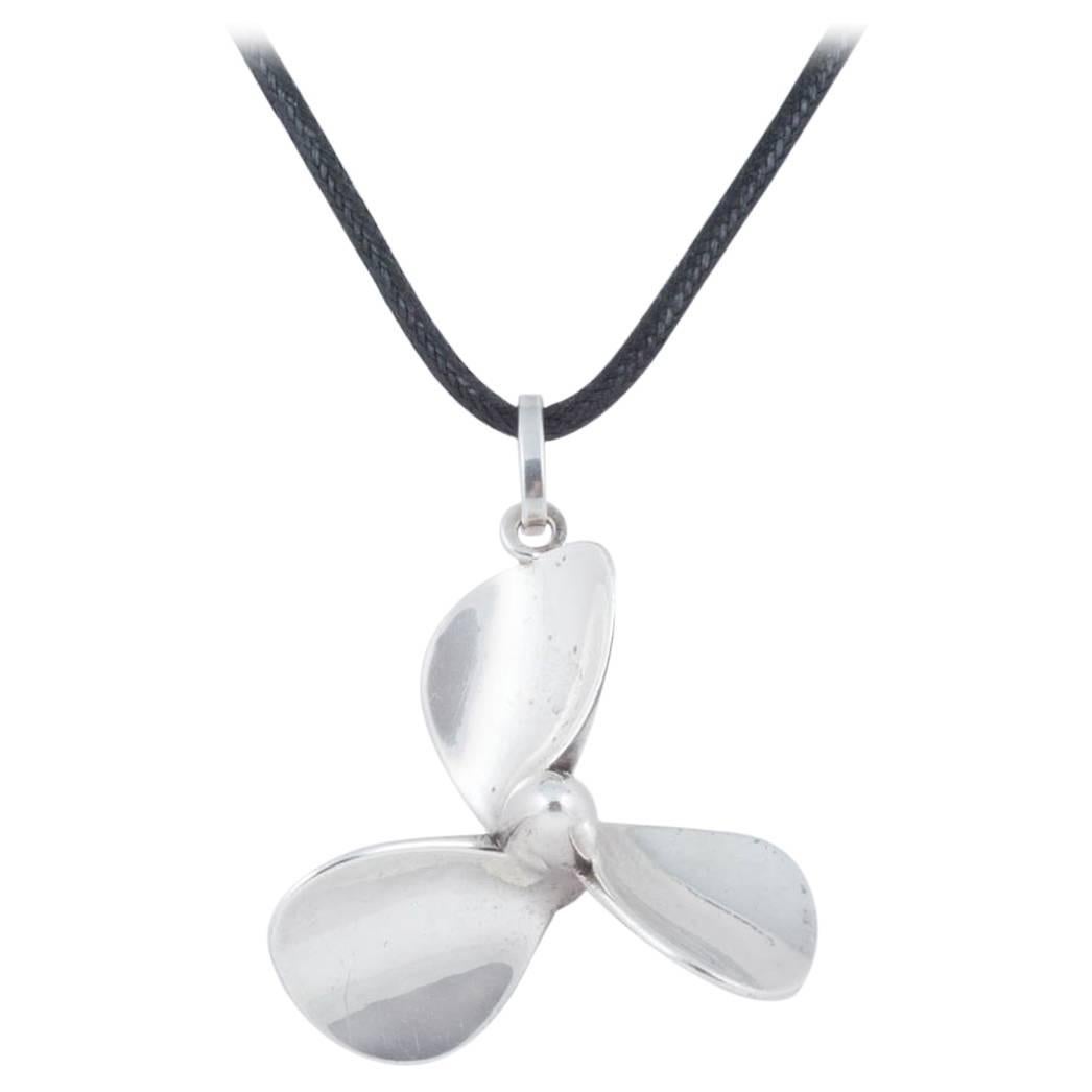 Sterling silver 'plane propeller' pendant, late 20th Century
