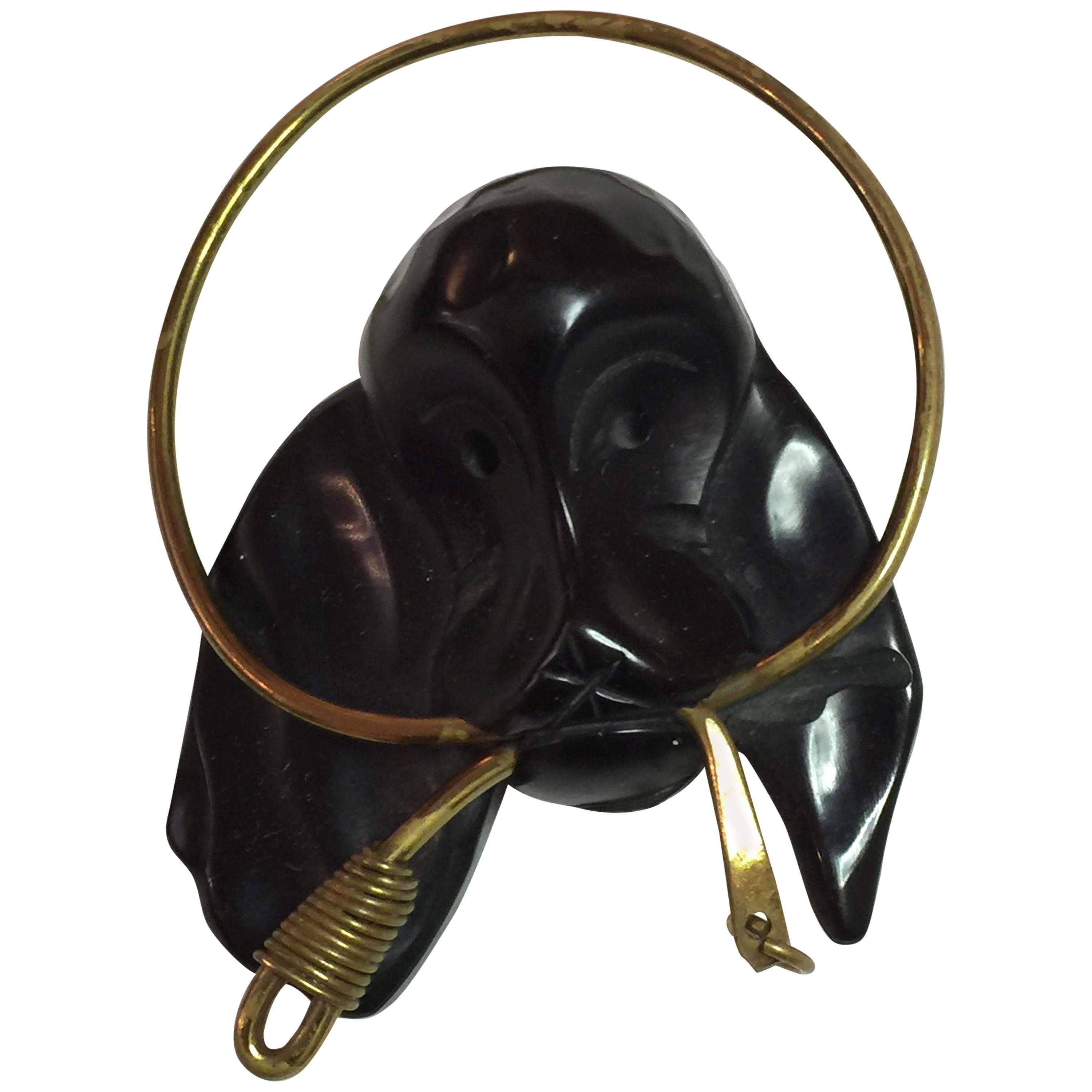1930s Figural Black Bakelite Dog with Brass Leash in Mouth Brooch Pin For Sale
