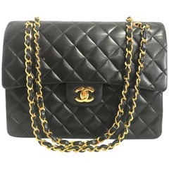 MINT. Vintage CHANEL black lambskin classic 2.55 double flap shoulder bag.