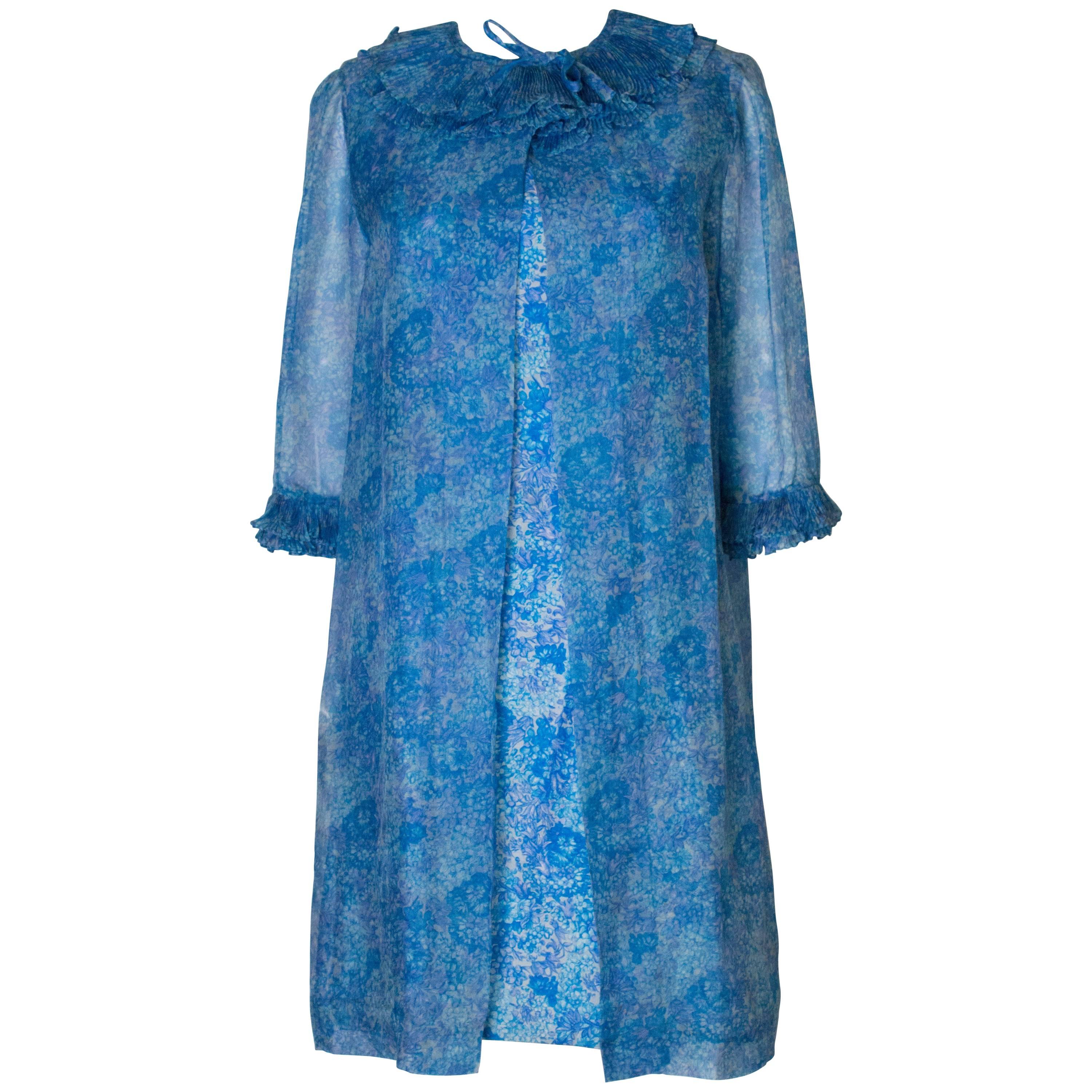 A Vintage 1960s blue printed Cocktail Dress and sheer matching Jacket