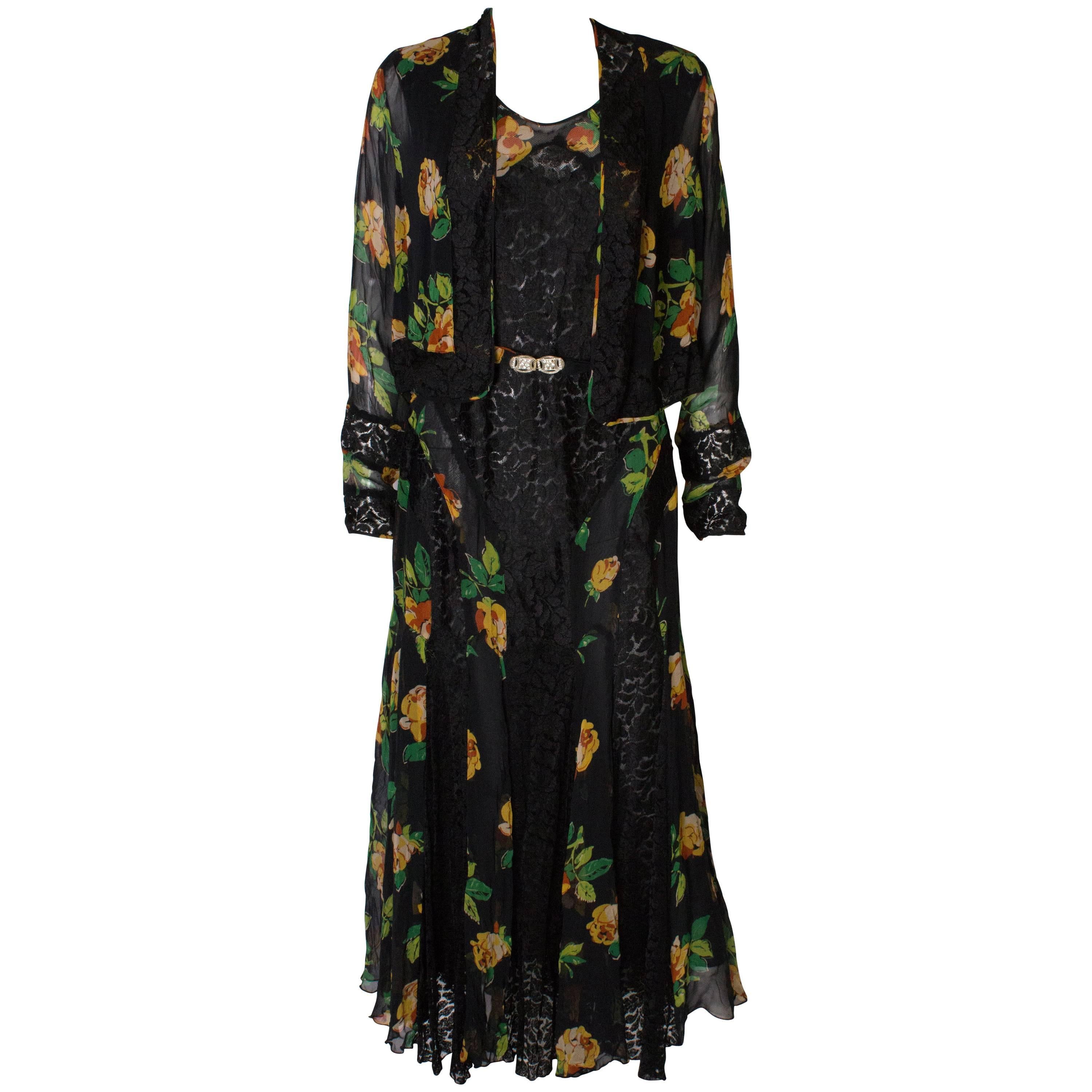 A Vintage 1920s floral silk print and black lace gown and matching bolero