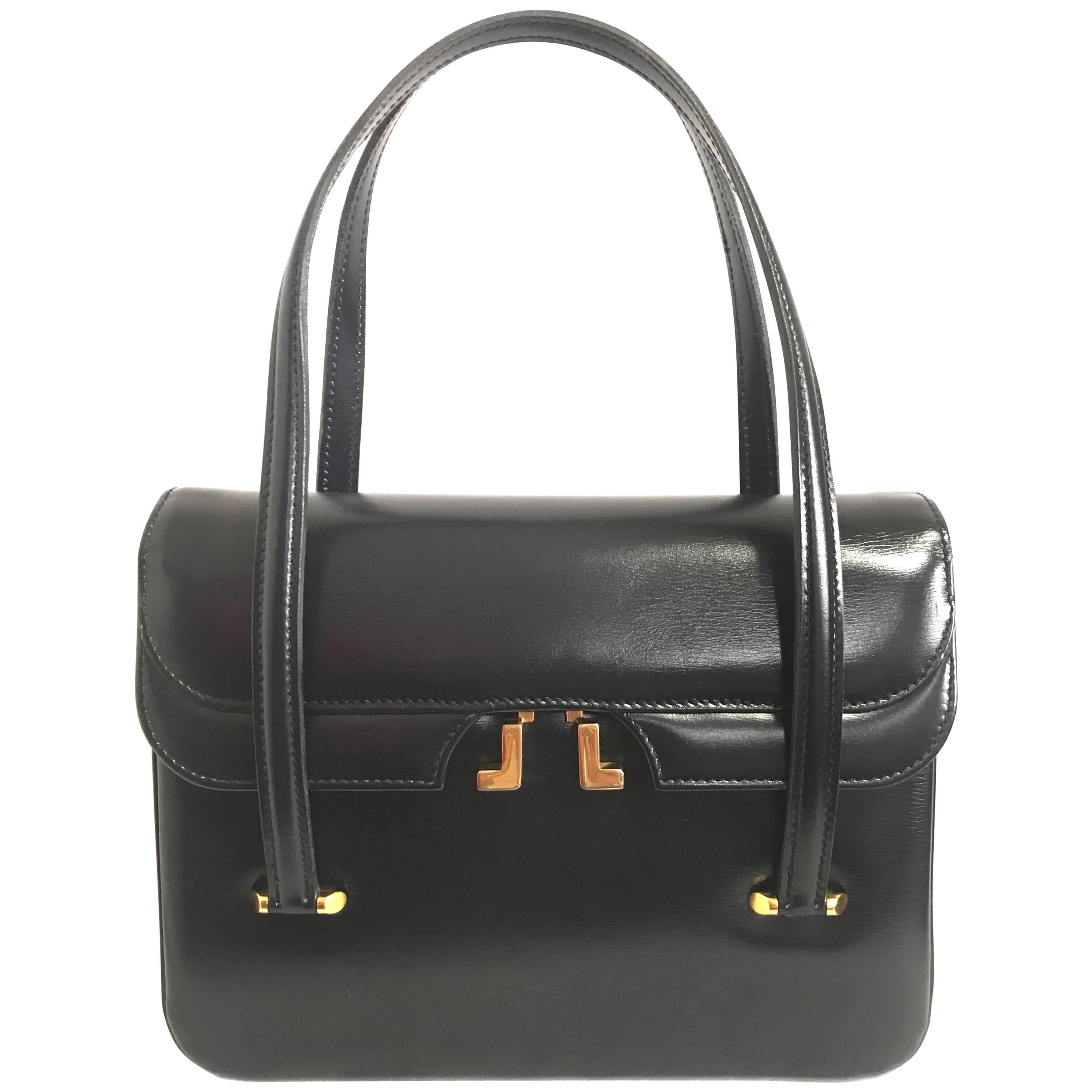 Vintage LANVIN black leather handbag with golden logo motif. Classic purse. For Sale