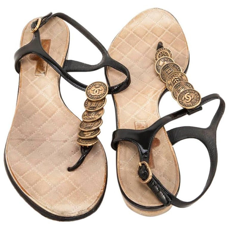 CHANEL Mules in Black Patent Leather and Antique Gold Plated Pieces