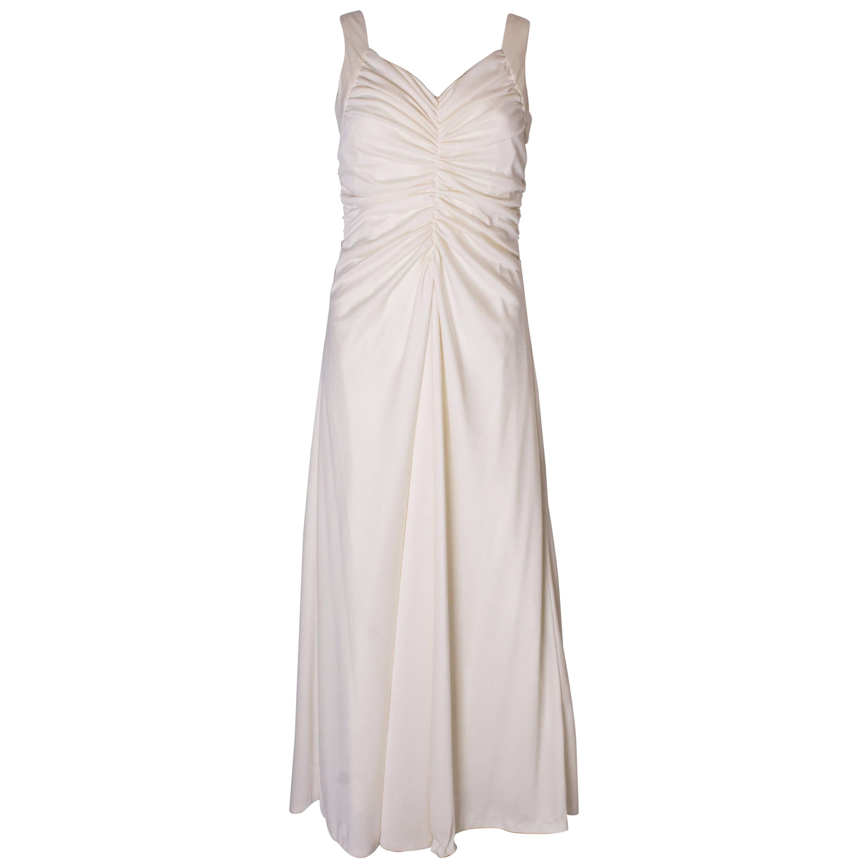 A Vintage 1970s cream evening dress by Maddison Avenue London 