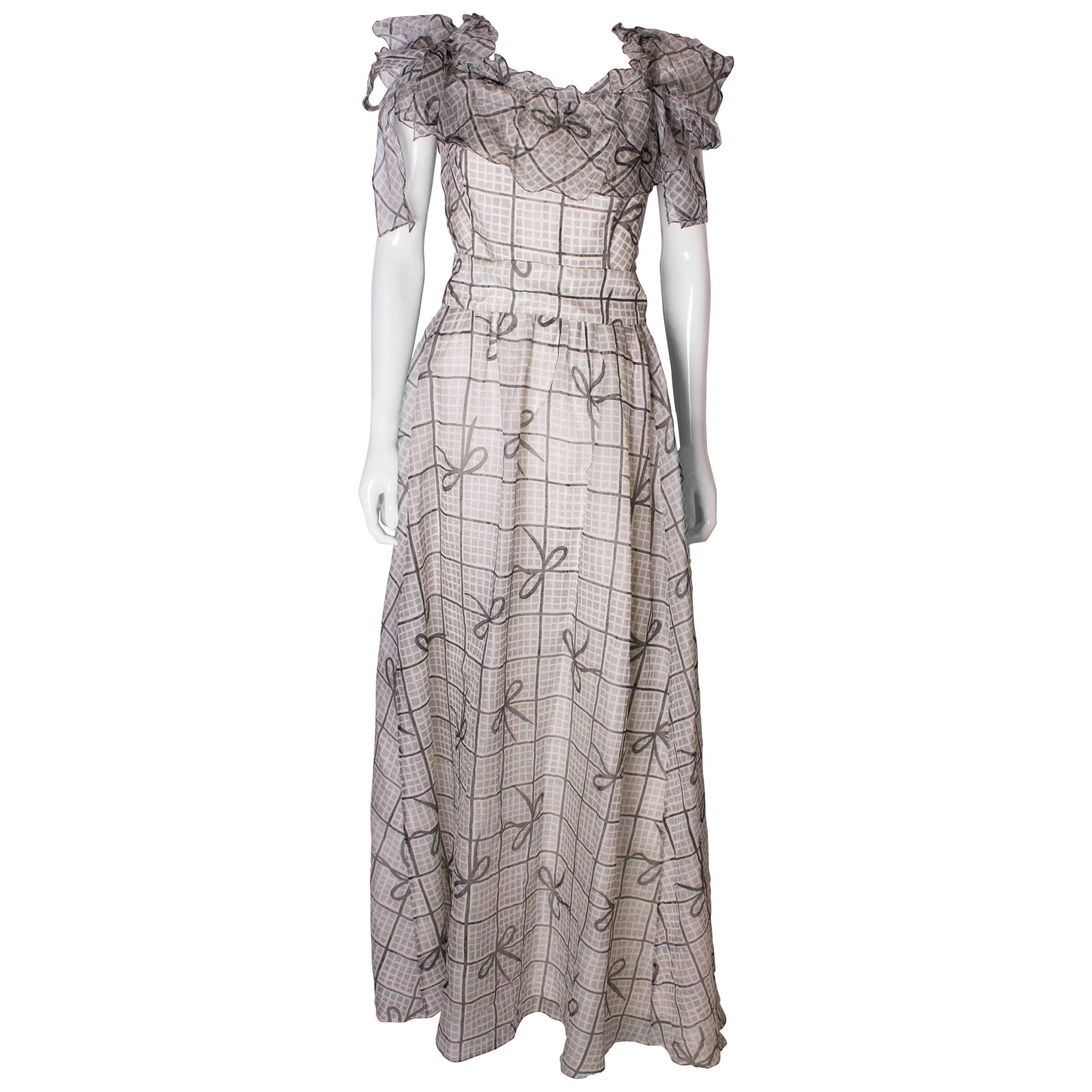 A Vintage 1970s grey printed silk evening gown by Gina Fratini For Sale