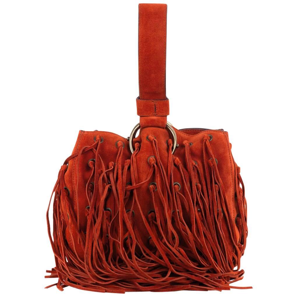 Roberto Cavalli Orange Suede Eyelet Fringe Wristlet Bucket Bag For Sale