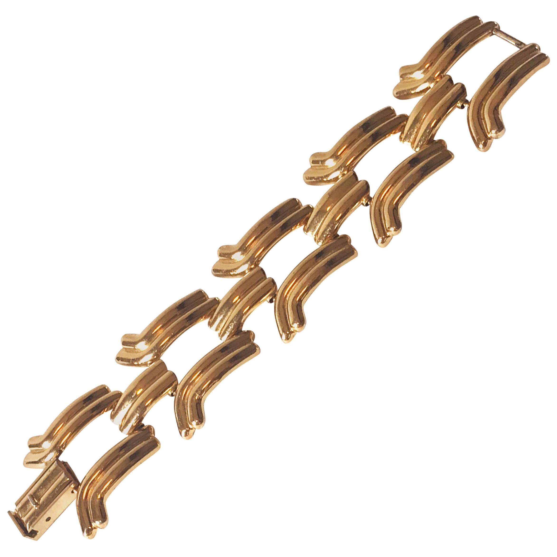 1940's style gilt metal LOEWE bracelet. For Sale