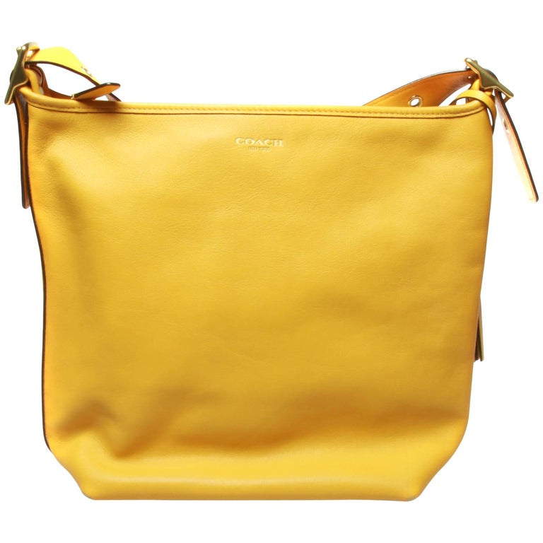 Coach large ladies yellow handbag duffle crossbody with dust cover and