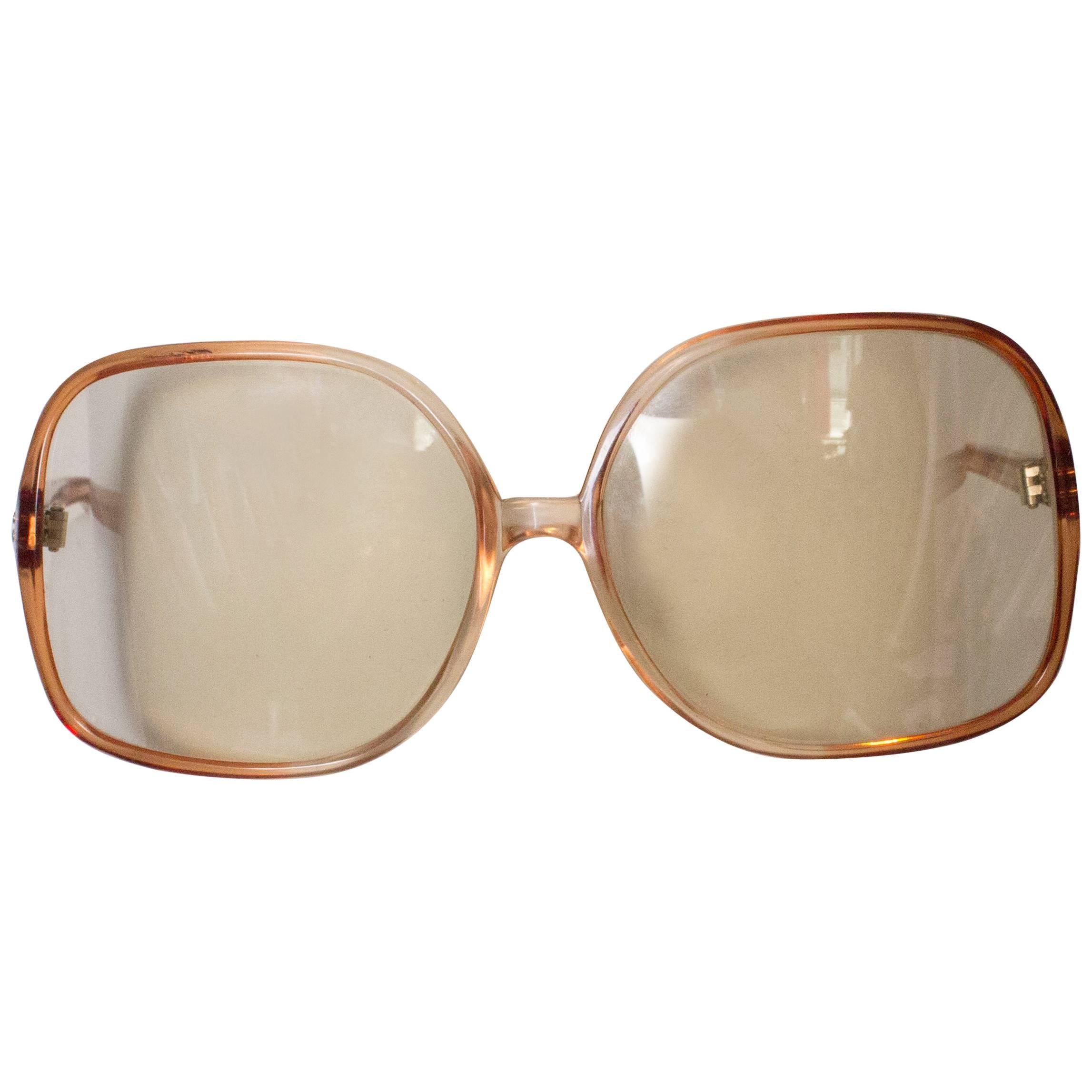 A pair of Vintage 1970s Sunglasses in a Bronze Coloured Frame
