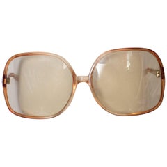 A pair of Vintage 1970s Sunglasses in a Bronze Coloured Frame