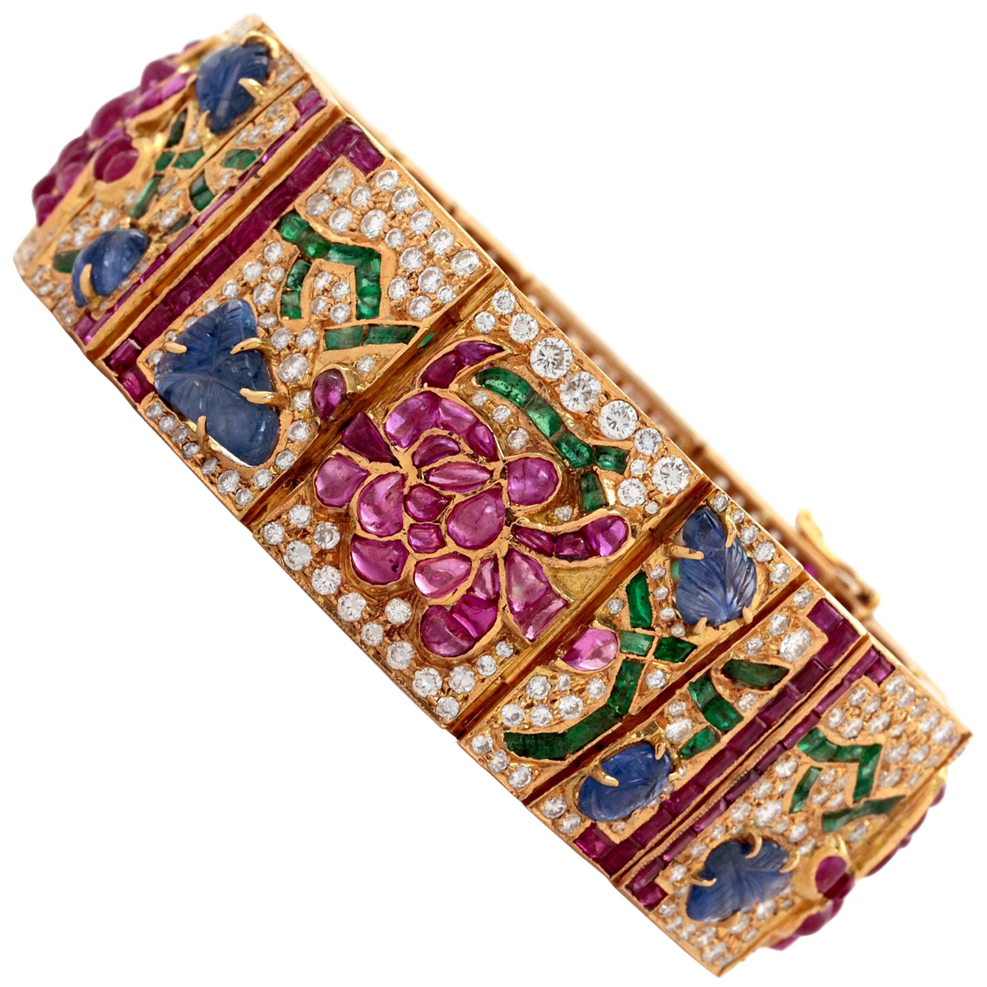 Mutli Gem Yellow Gold Bracelet with Diamonds, and Sapphires in a Flower design. For Sale
