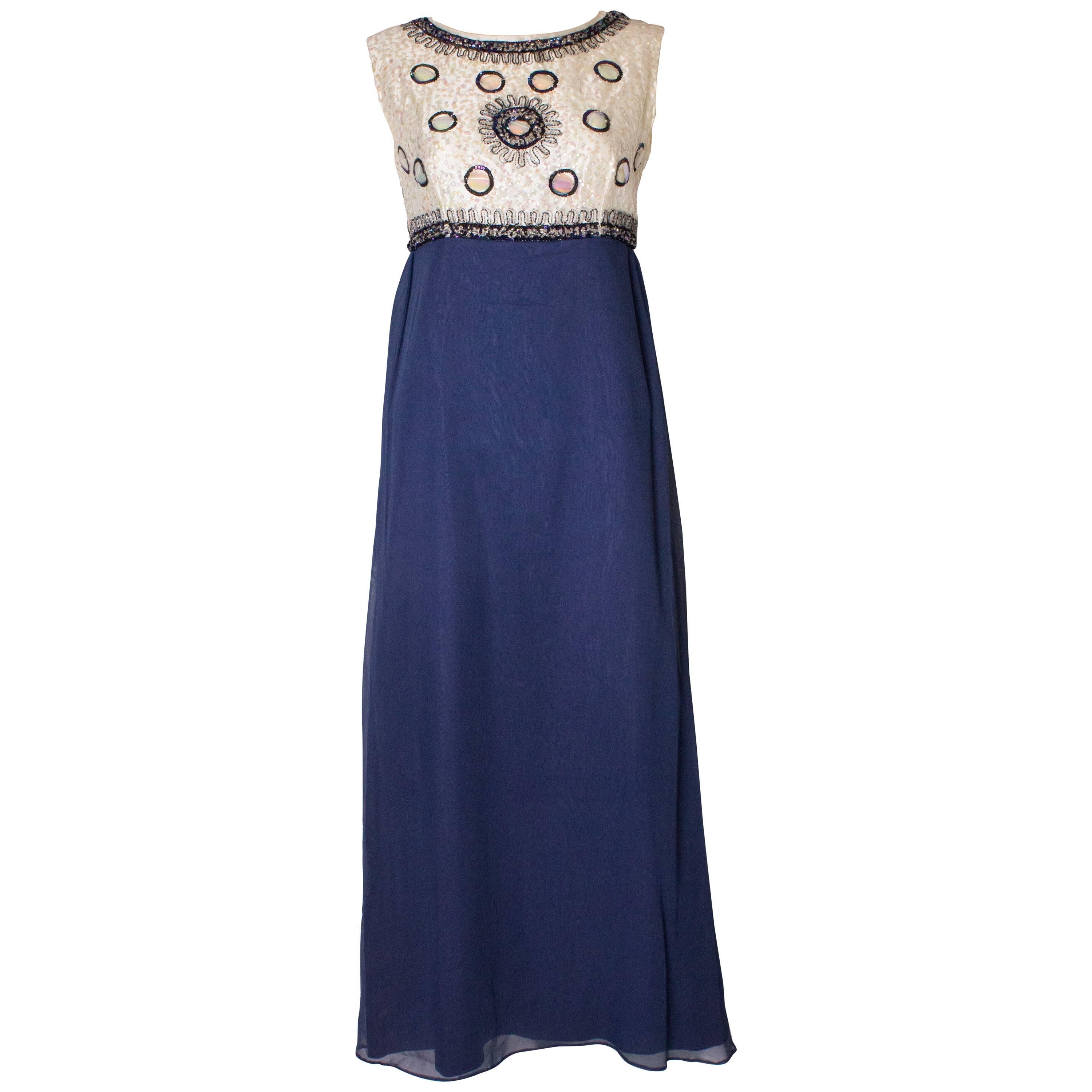 A Vintage 1960s sequin blue chiffon evening gown by Laura Phillips