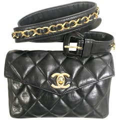 Vintage CHANEL black lamb belt bag, fanny pack with golden chain belt and CC.
