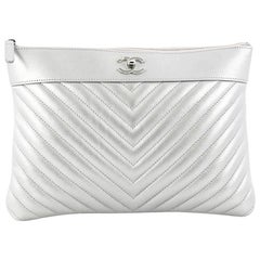 Chanel O Case Clutch Chevron Lambskin Medium