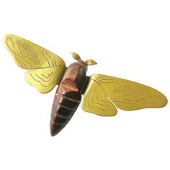 Carved wood and engraved brass 'moth' brooch, France, 1950s