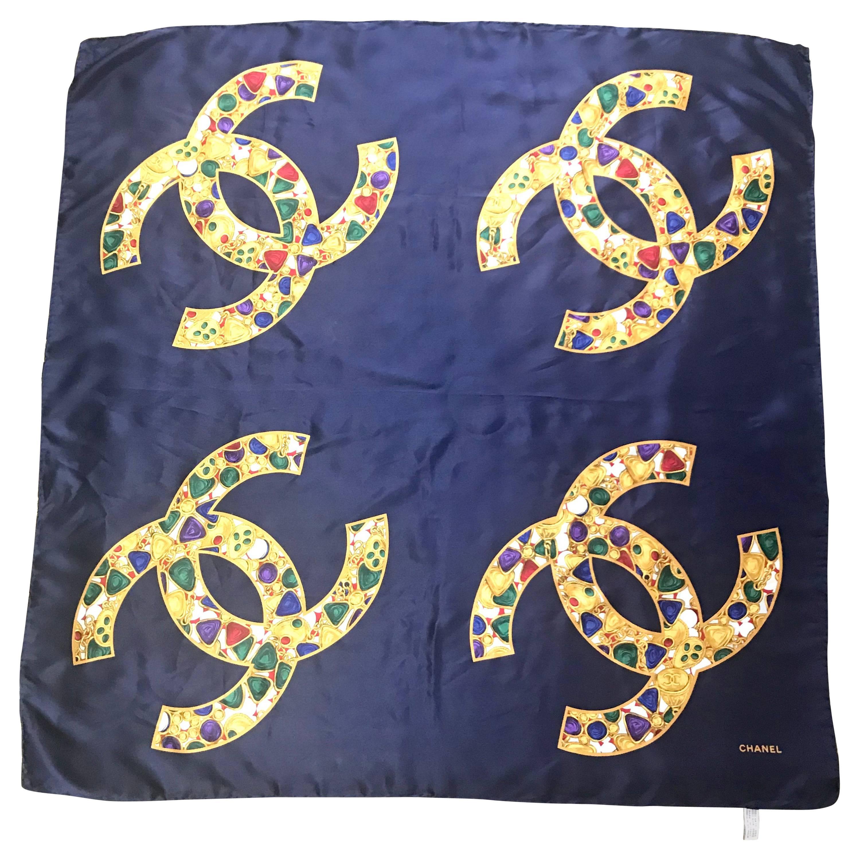 Vintage CHANEL navy silk scarf with gold, red, purple, green jewelry print in CC