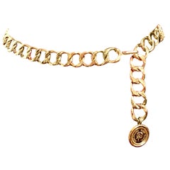 MINT. Vintage CHANEL golden thick chain belt with CC and mademoiselle charm.