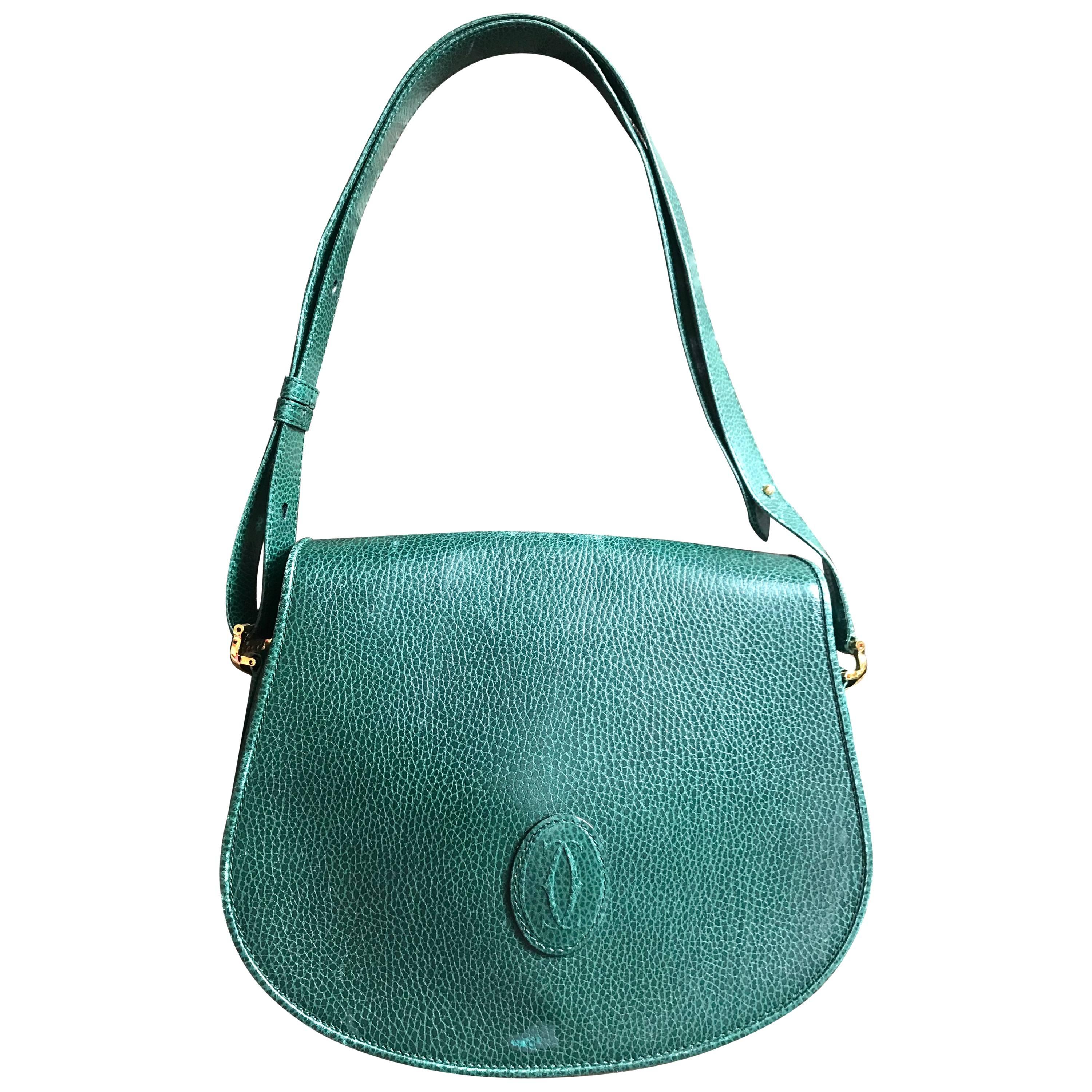 Vintage Cartier green grained leather oval round shape shoulder bag. Rare color  For Sale