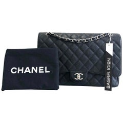 Chanel Single Flap Maxi in black caviar leather with silver hardware