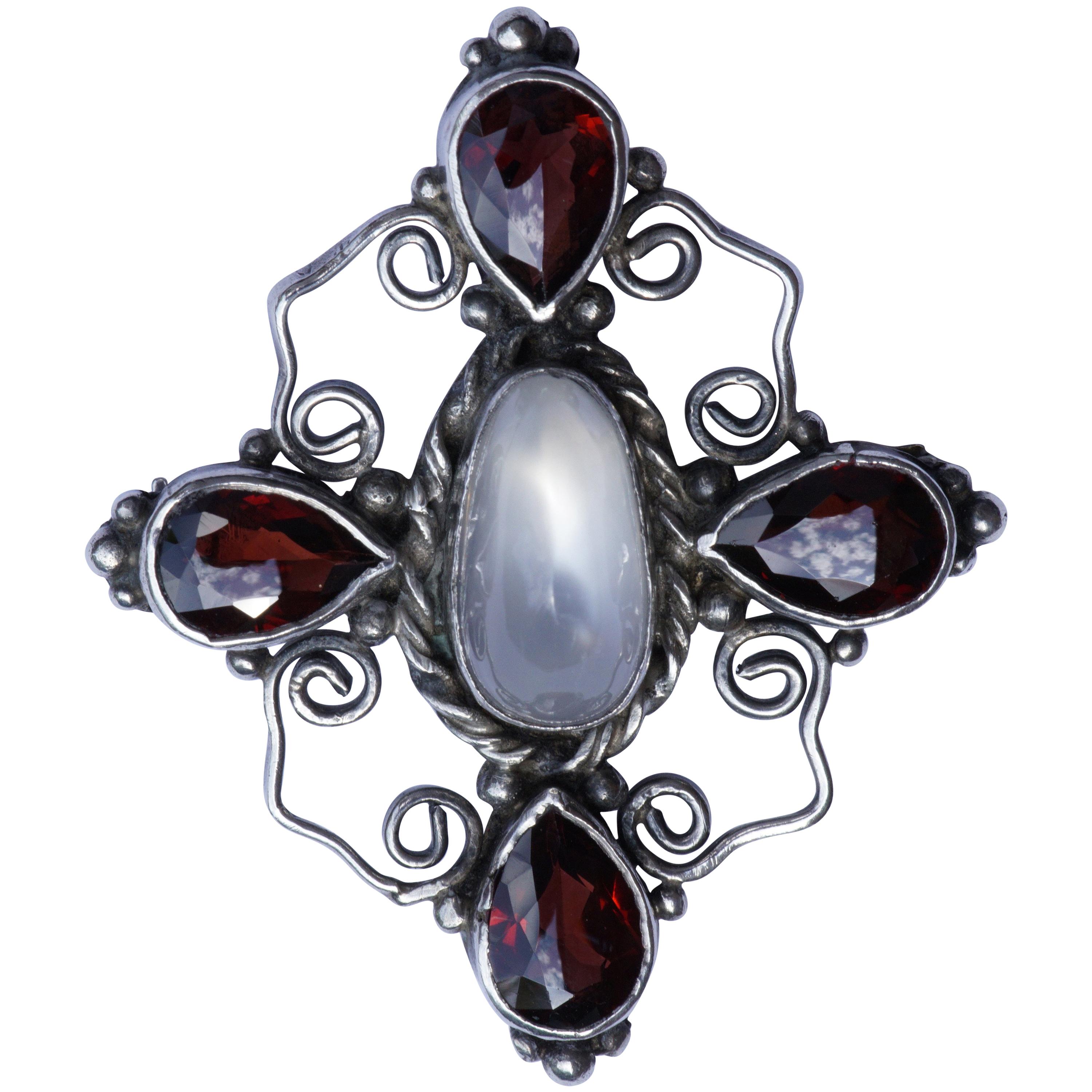 Hand Made Silver Brooch with a Faux Moonstone and Faux Garnets circa 1920s For Sale