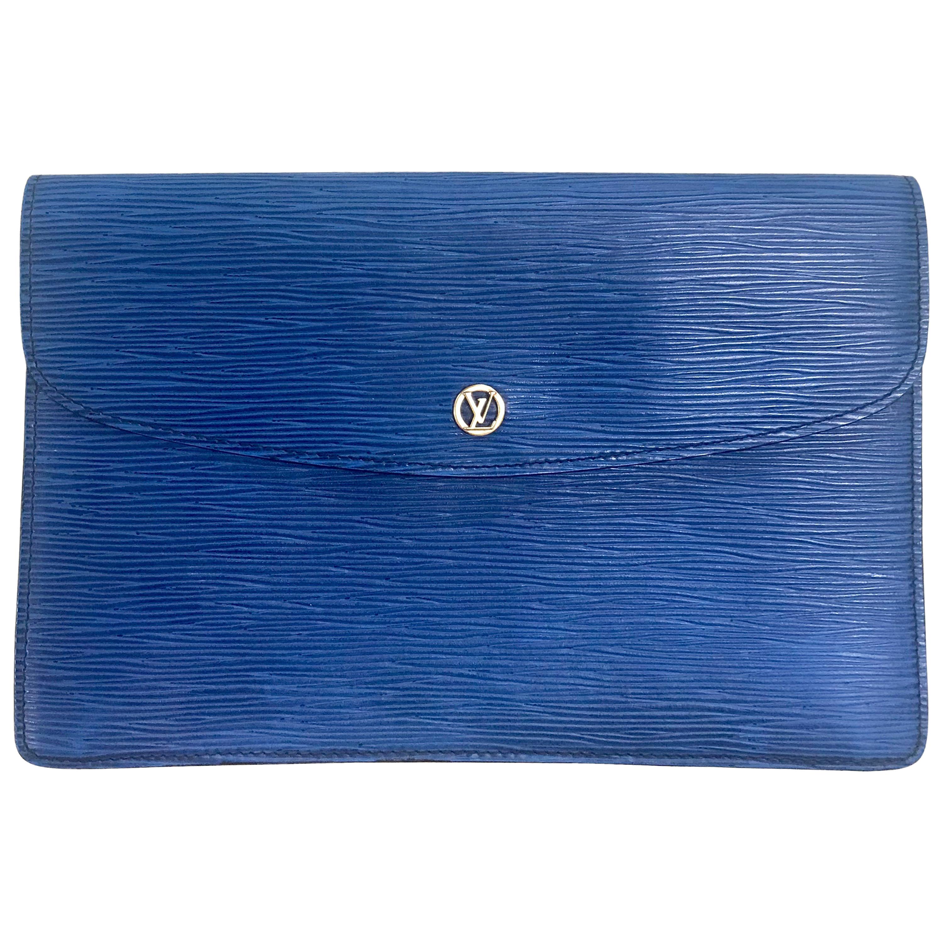 Vintage Louis Vuitton blue epi envelope style clutch bag with gold tone LV motif For Sale