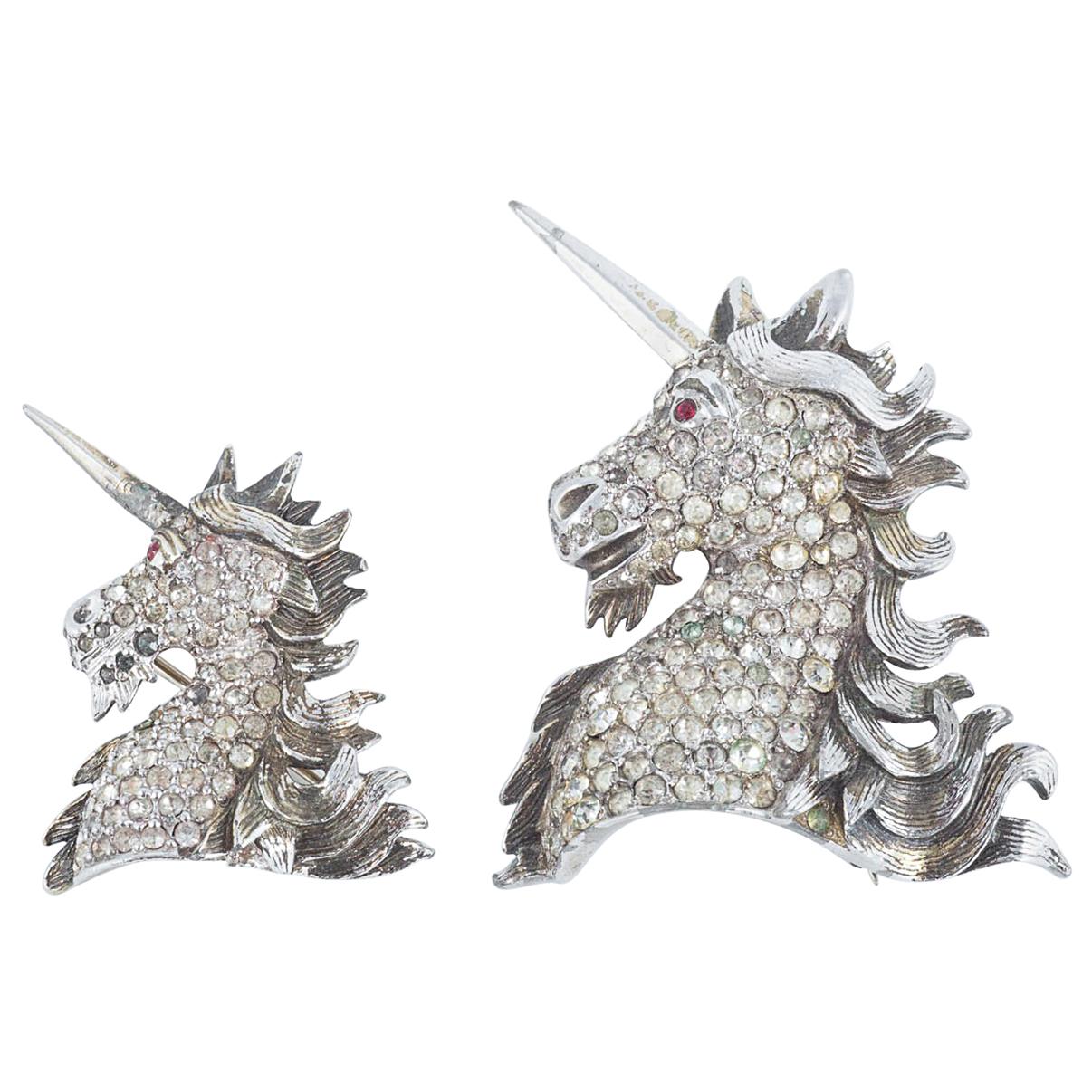 A pair of paste and gilt metal 'unicorn' brooches, Christian Dior, c1954.