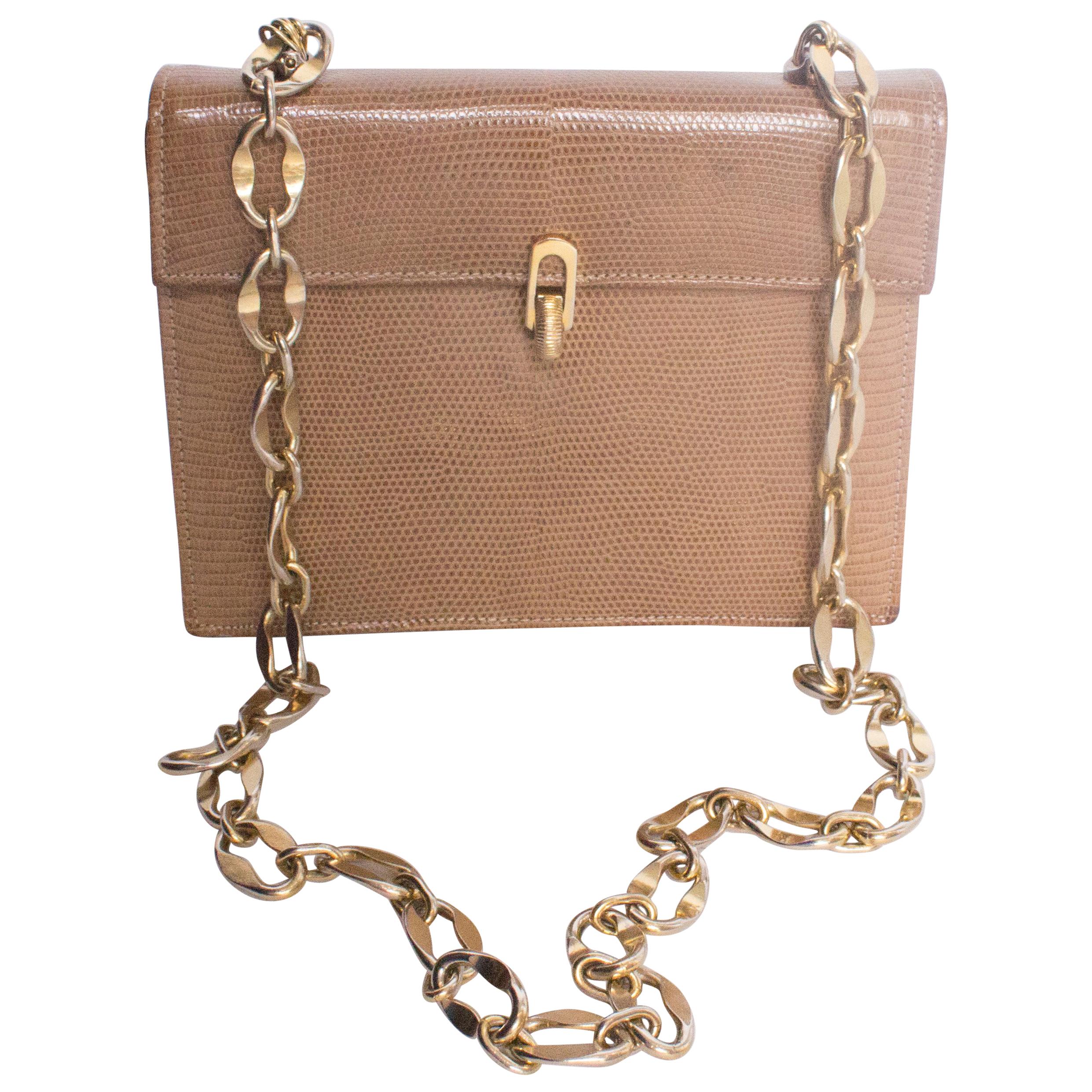 A Vintage 1970s Lizzard Handbag with a Gold Chain