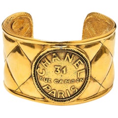 Chanel 1980s Gold Tone Quilted Rue Cambon 31 Cuff Bracelet