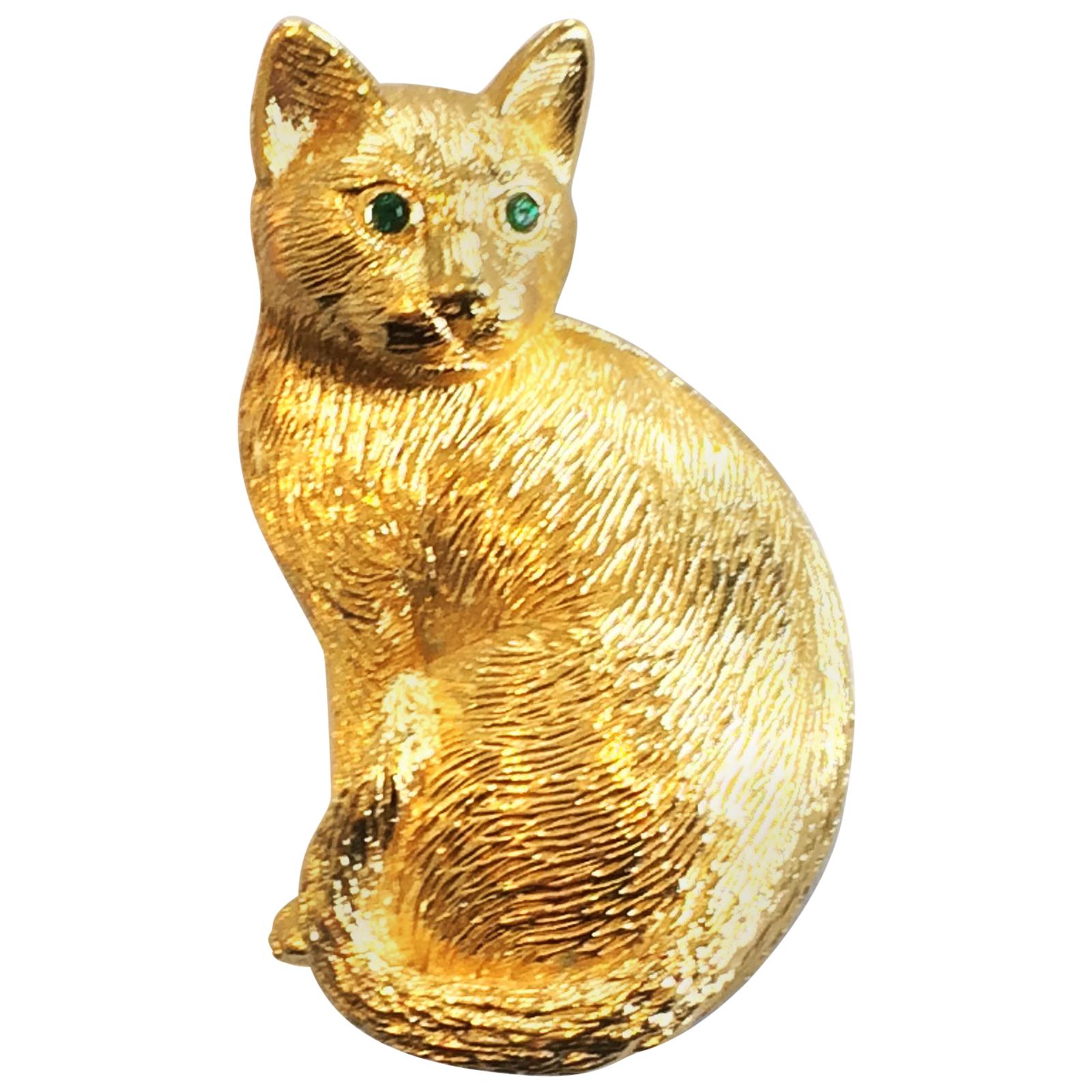 Christian Dior 1960s Cat brooch or pin in gilt metal with emerald eyes