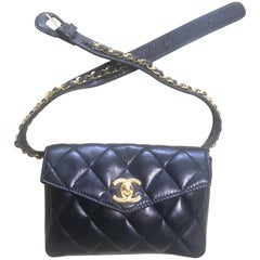Vintage CHANEL black lamb waist bag, fanny pack with golden chain belt and CC.