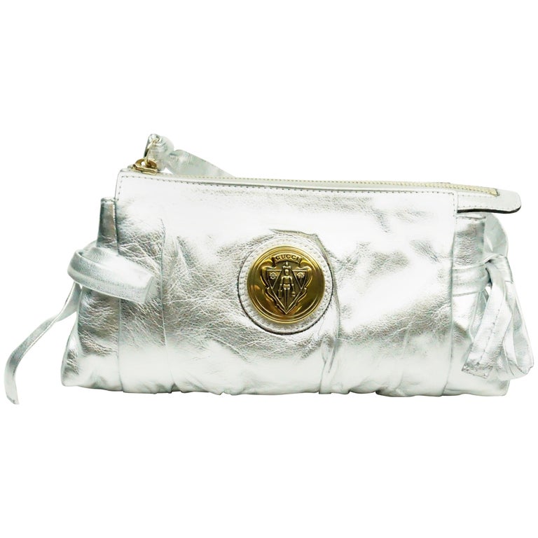 Gucci Silver Metallic Leather Clutch with Gold Emblem at 1stDibs