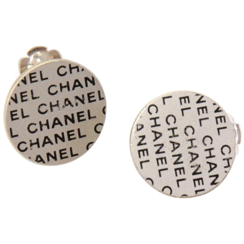Chanel Silver & Black Logo Pattern Flat Round Earrings For Sale