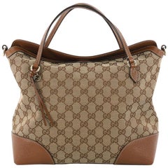 Gucci Bree Convertible Top Handle Bag GG Canvas 