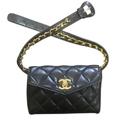 Retro CHANEL black belt bag, fanny pack with golden chain belt and CC. 28”-30”