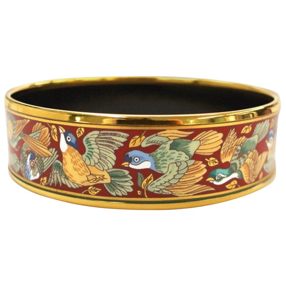 Vintage Hermes cloisonne enamel golden bangle with bird design. For Sale
