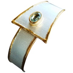  1.10 carat Aquamarine with 24 karat gold trims Geometric Silver Bangle Bracelet