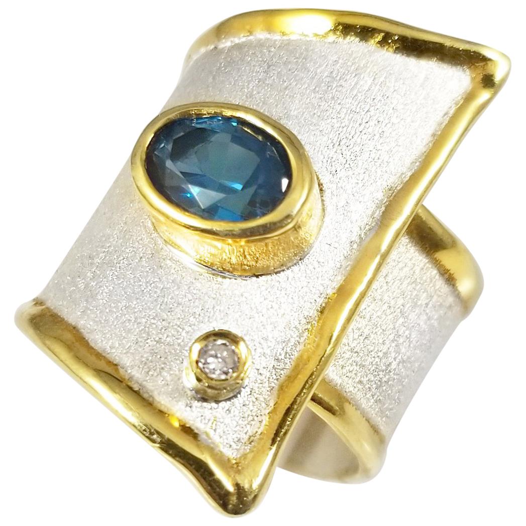 1.60 Carat Blue Topaz 24K Gold trims Fine silver 950 Overlapping Statement Ring  For Sale