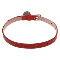 Alexandra Mcqueen red leather bracelet with small skull pendant with glass eyes