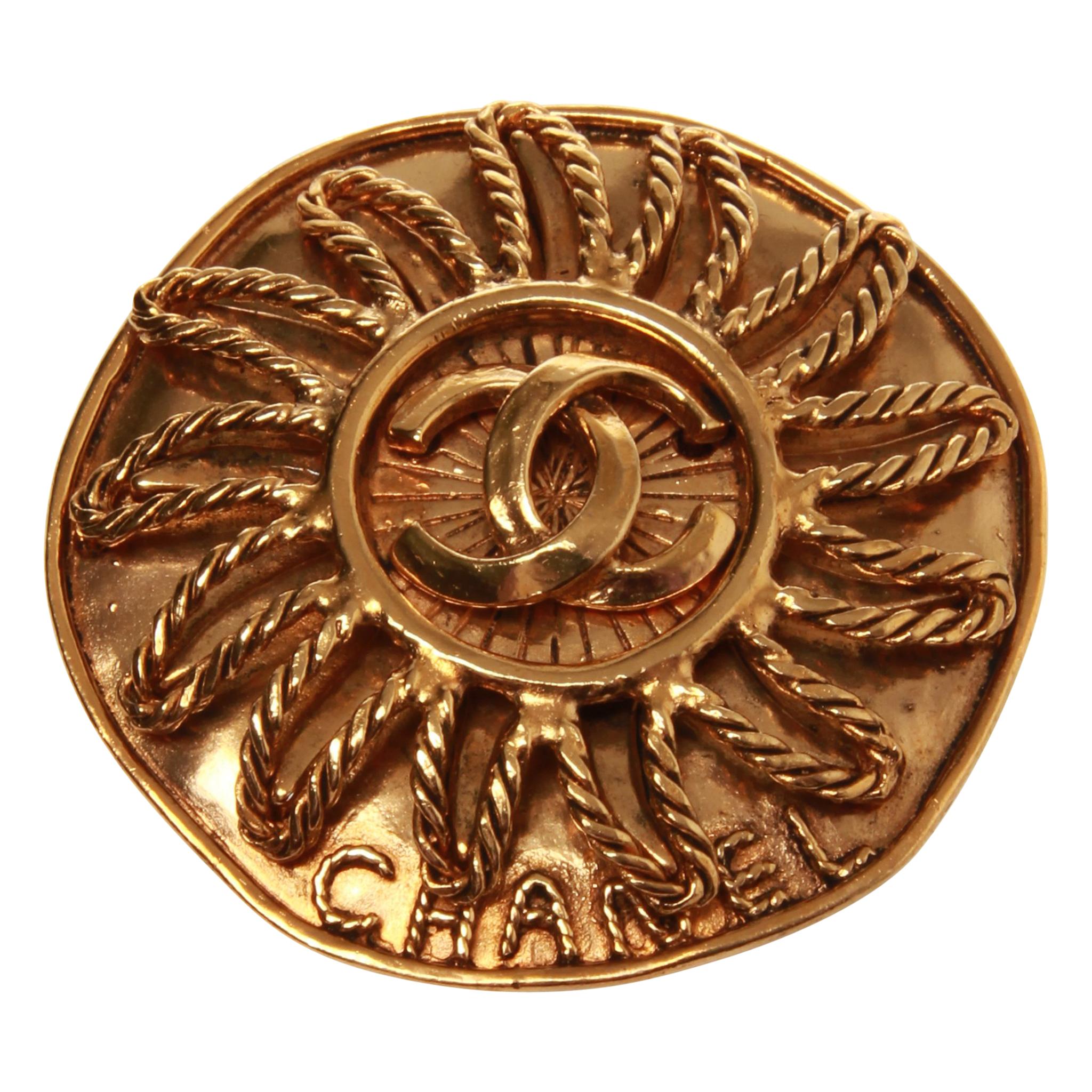 Chanel gold sun brooch with double CC
