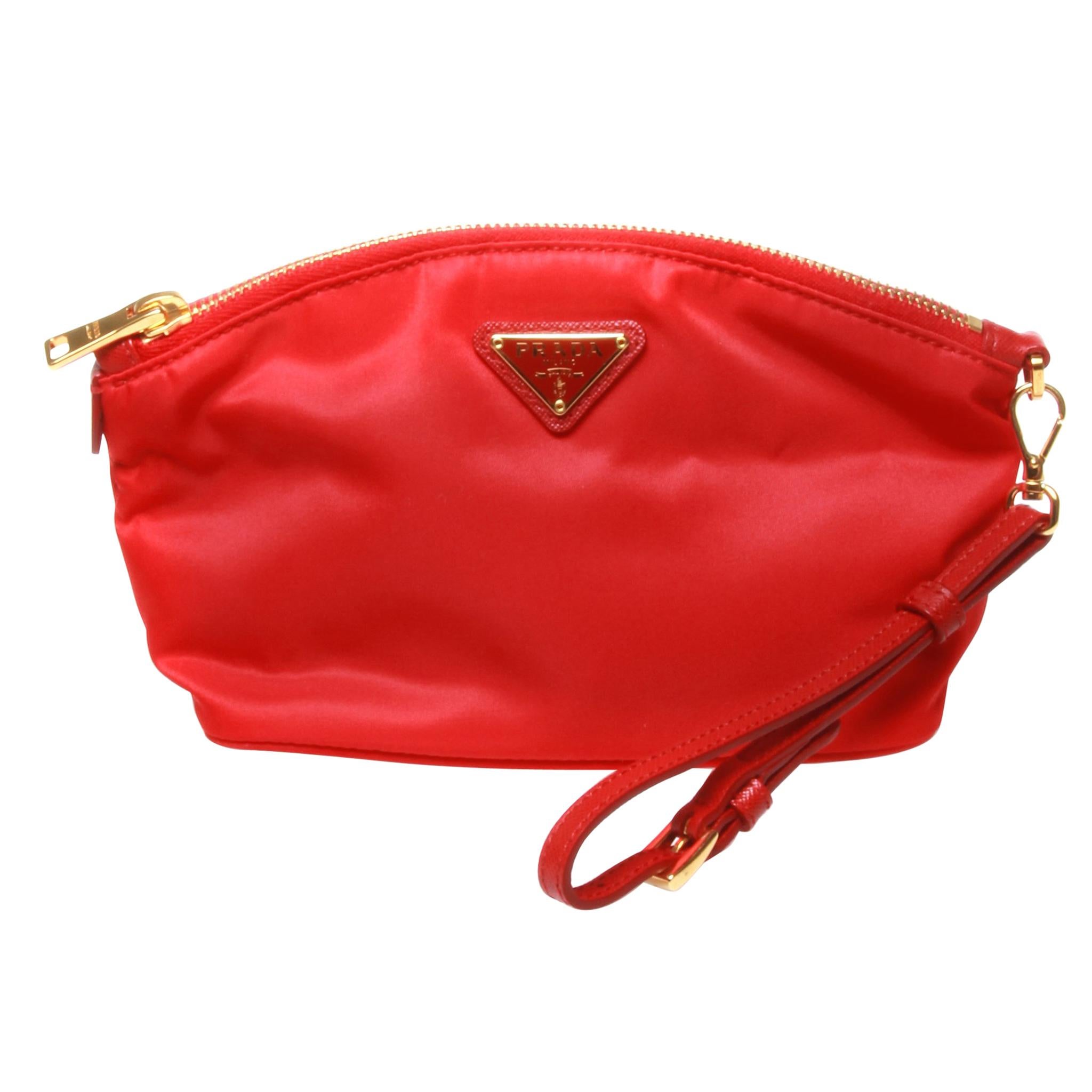 	Prada small red clutch with gold hardware and red leather strap